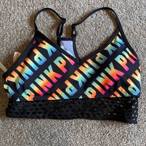 Rainbow logo pink sports bra with black netting